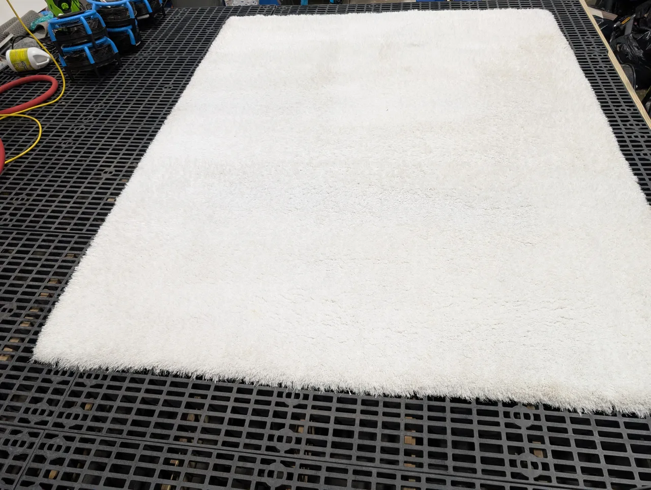 Same rug after professional washing, restored to bright white